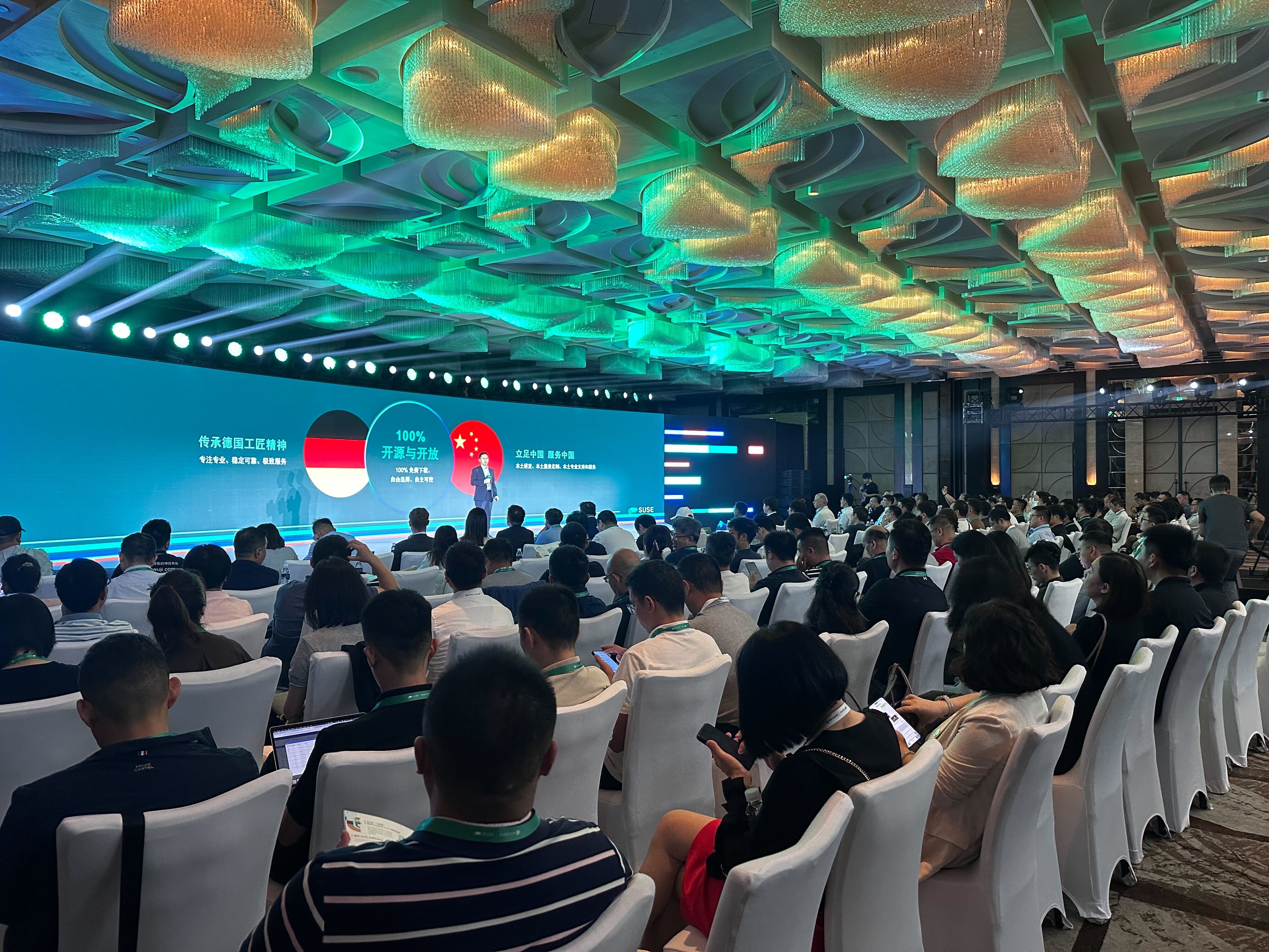 An audience view at SUSECON China 2024's Keynote, with Alan Chan, General Manager for Greater China